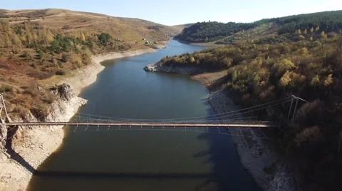 Aerial view on mountain river surrounded with autumn forest and mountains Stock Footage 68383086