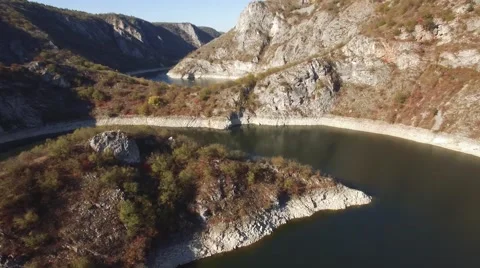 Aerial view on mountain river surrounded with autumn forest and mountains Stock Footage 68383119
