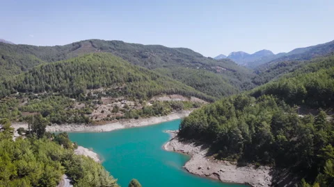 Aerial view of a mountain river in a valley between mountains in summer. Video stock 130397258