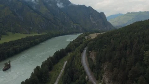 Aerial view of mountain river valley and winding road in Altai, Russia Stock Footage 334099113