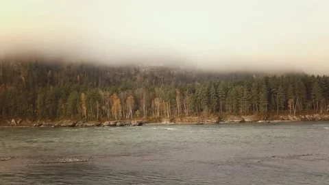 Aerial view of mountain river, valleys and forest through clouds in the morning Stock-Footage 144200993