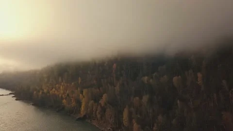 Aerial view of mountain river, valleys and forest through clouds in the morning Stock-Footage 144201106