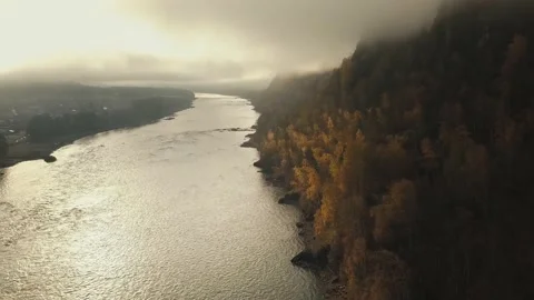 Aerial view of mountain river, valleys and forest through clouds in the morning Stock-Footage 144201724