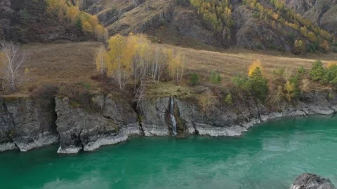 Aerial view of mountain river with waterfall in sunny autumn day. Stock Footage 314810644