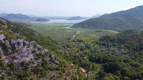 Aerial View of Mountain River Winding Through Valley at Skadar Lake Montenegro Stock-Footage 342772711