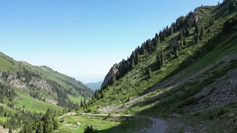 Aerial view of mountain road and valley near Mynzhylky, Kazakhstan Stock Footage 340462277