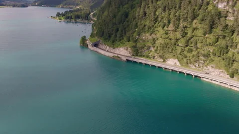 Aerial View of Mountain Road and Tunnel Along Lake Achensee, Tyrol, Austria Stock Footage 340488221