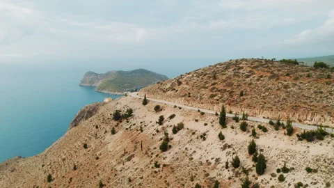 Aerial view of mountain road on cliffside coast in Kefalonia Island Greece in Stock-Footage 326031187