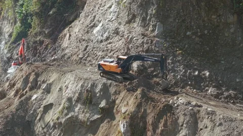 Aerial View of Mountain Road Construction and Landslide Clearing in India Stock Footage 332688899