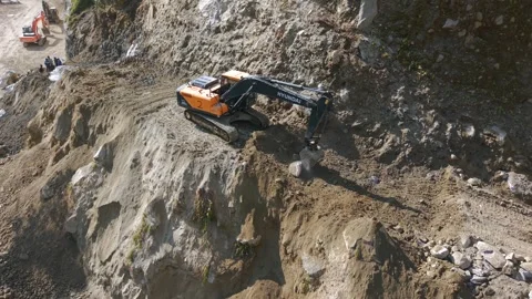 Aerial View of Mountain Road Construction and Landslide Clearing in India Video stock 332688910