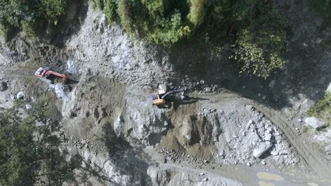 Aerial View of Mountain Road Construction and Landslide Clearing in India Stock Footage 332688921