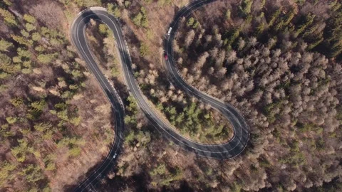 Aerial view of mountain road during springtime.Cars driving in the mountain road Stock Footage 151253530