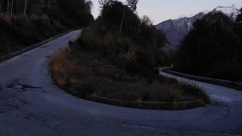 Aerial view of mountain road with switchbacks, in the autumn of evening Stock Footage 119850033