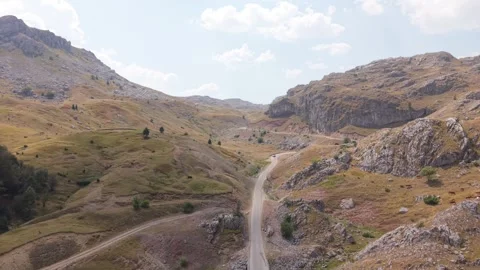 Aerial View of Mountain Road Through Drought-Affected Landscape on Visocica Vídeos de archivo 343149258