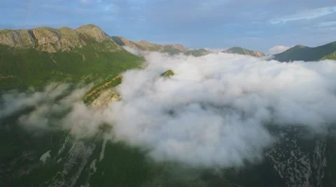Aerial view the mountain shrouded in clouds Stock Footage 63475582