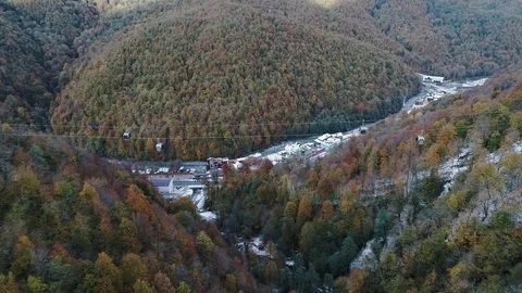 Aerial view of mountain ski resort and Cable car Stock Footage 102483010