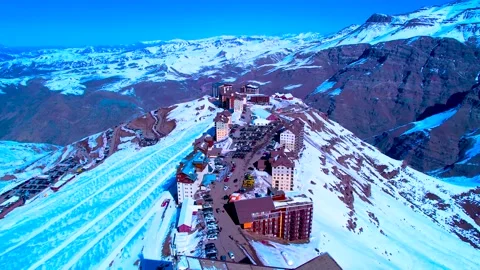 Aerial View of Mountain Ski Resort Village in Winter Stock Footage 346731470
