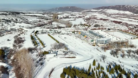 Aerial view of mountain ski stadium with snow Vídeos de archivo 330050673