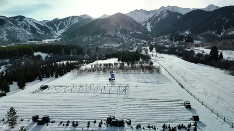 Aerial view of mountain ski stadium with snow Vídeo Stock 330050732