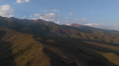 Aerial view of mountain slopes in evening light, Issyk-Kul Region, Kyrgyzstan Stockbeeldmateriaal 347240107