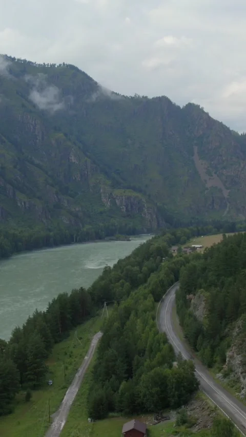 Aerial view of Mountain Spirits Gorge with river and road in Altai Mountains Stock Footage 335660414