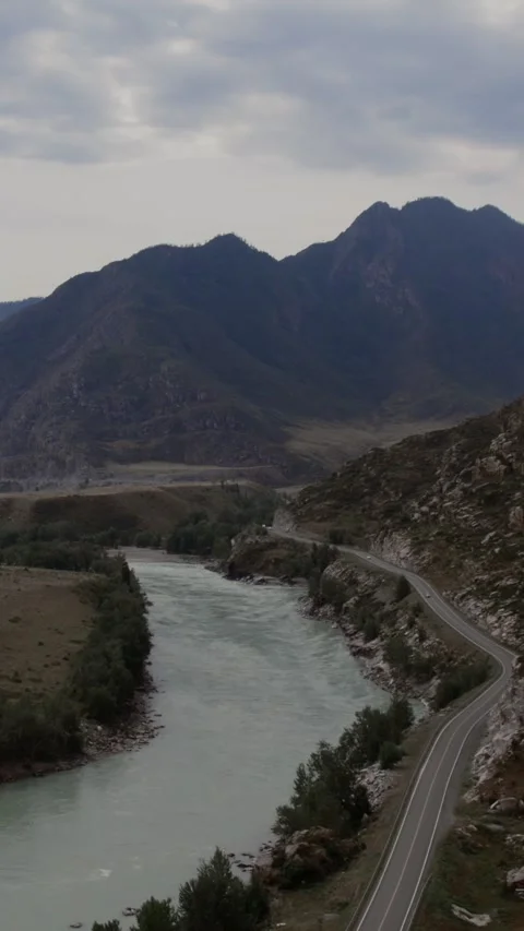 Aerial view of Mountain Spirits Gorge river valley and road in Altai Mountains Stock Footage 335662174