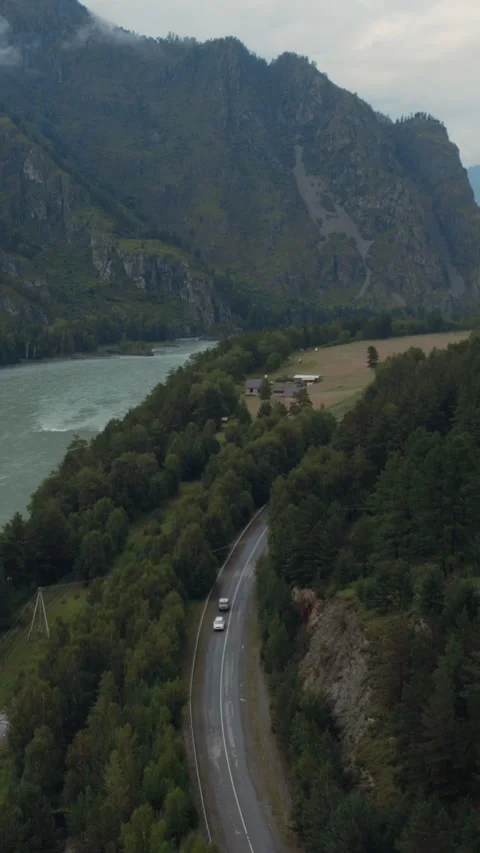 Aerial view of Mountain Spirits Gorge in Altai with river, road and cliffs Stock Footage 335662258
