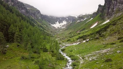 Aerial view of the mountain stream in the Alpine mountains. Austria Stock Footage 92454651