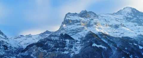 Aerial view of mountain tops in The Swiss Alps, Switzerland. The mountains are p Stock Footage 121486053