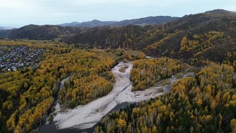Aerial View of a Mountain Town and Winding Autumn River Stock Footage 348245553