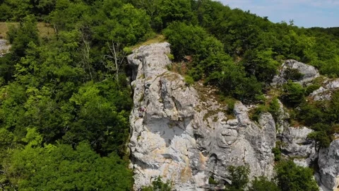 Aerial view of mountain with unrecognizable climber. Spectacular aerial climbing Stock Footage 246554197