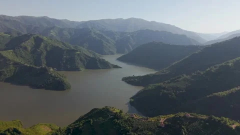 Aerial view of a mountain valley with a winding river Stock Footage 341805834