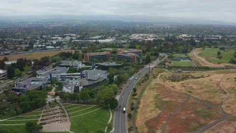 Aerial view of Mountain View office buildings, suburban homes, marsh, cars Stock Footage 308205342