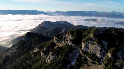 Aerial view of mountainous landscape with forests. Valley full of fog. Stock-Footage 293776355