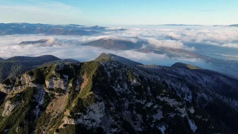 Aerial view of mountainous landscape with forests. Valley full of fog. Stock-Footage 293776802