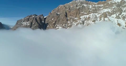 Aerial view of the mountains above the clouds Stock Footage 150664709