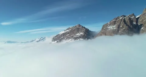 Aerial view of the mountains above the clouds Stock Footage 150664751