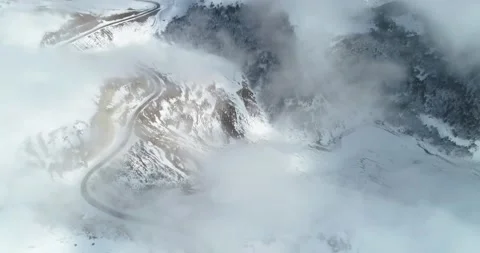 Aerial view of the mountains above the clouds Stock Footage 150664824