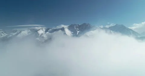 Aerial view of the mountains above the clouds Stock Footage 150664825