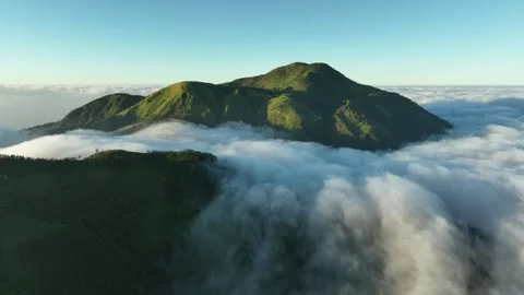 Aerial View of Mountains Above the Clouds at Sunrise Stock Footage 244727852