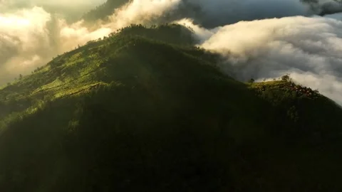 Aerial View of Mountains Above the Clouds at Sunrise Stock Footage 244755915