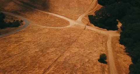 Aerial view of mountains with brown grass field Stock Footage 117262242