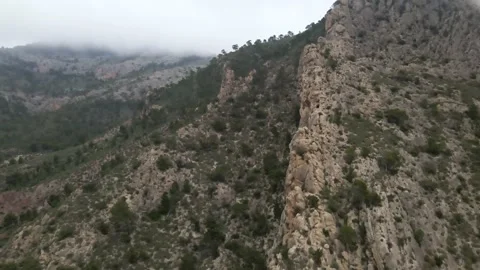 Aerial view of the mountains in the clouds Stock Footage 239943419