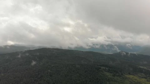 Aerial View Of Mountains, Clouds, Forests, And Sunlight. Vidéo 299848043