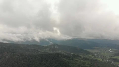 Aerial View Of Mountains, Clouds, Forests, And Sunlight. Vidéo 299848109