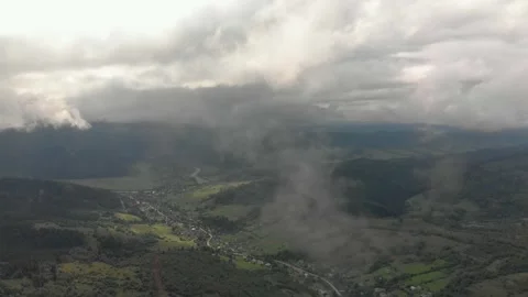 Aerial View Of Mountains, Clouds, Forests, And Sunlight. Vidéo 299848837