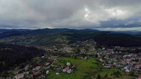 Aerial View Of Mountains, Clouds, Forests, And Sunlight. Vidéo 300380284
