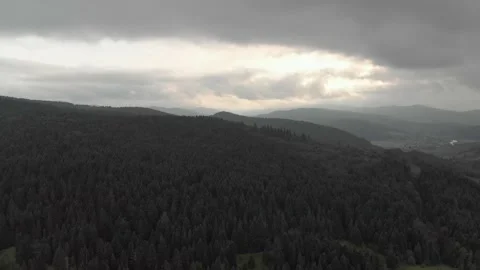 Aerial View Of Mountains, Clouds, Forests, And Sunlight. Vidéo 300740419