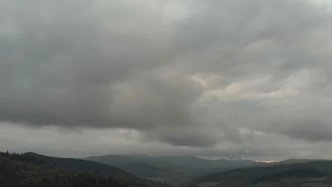 Aerial View Of Mountains, Clouds, Forests, And Sunlight. Vidéo 300740557