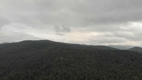 Aerial View Of Mountains, Clouds, Forests, And Sunlight. Vidéo 300740681
